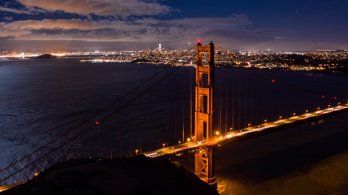 A hotel room with a view of the San Francisco skyline and bay beyond